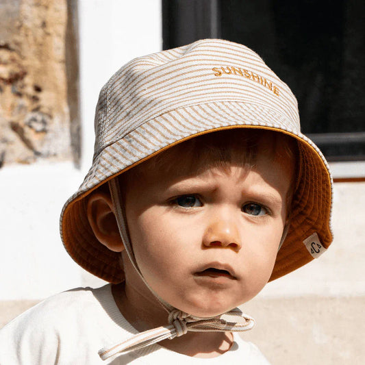 Bob anti-UV pour bébé, accessoire indispensable à la plage