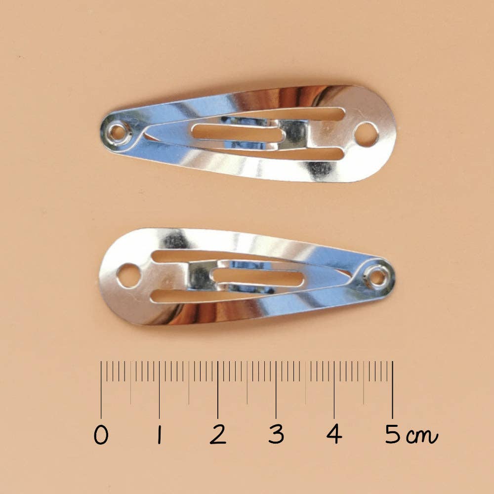 Luciole et Petit Pois - Barrettes cœurs - Paillettes roses (paire)